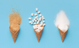 ice cream cones filled with brown sugar, white sugar and cubed sugar